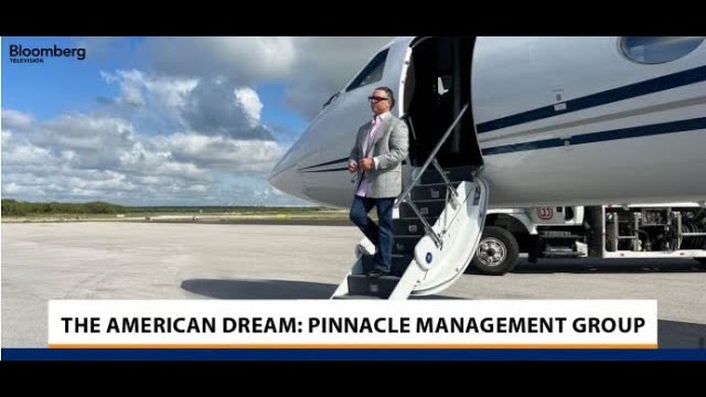 Dennis S. Amodio stepping off a private jet, from the Bloomberg Television segment