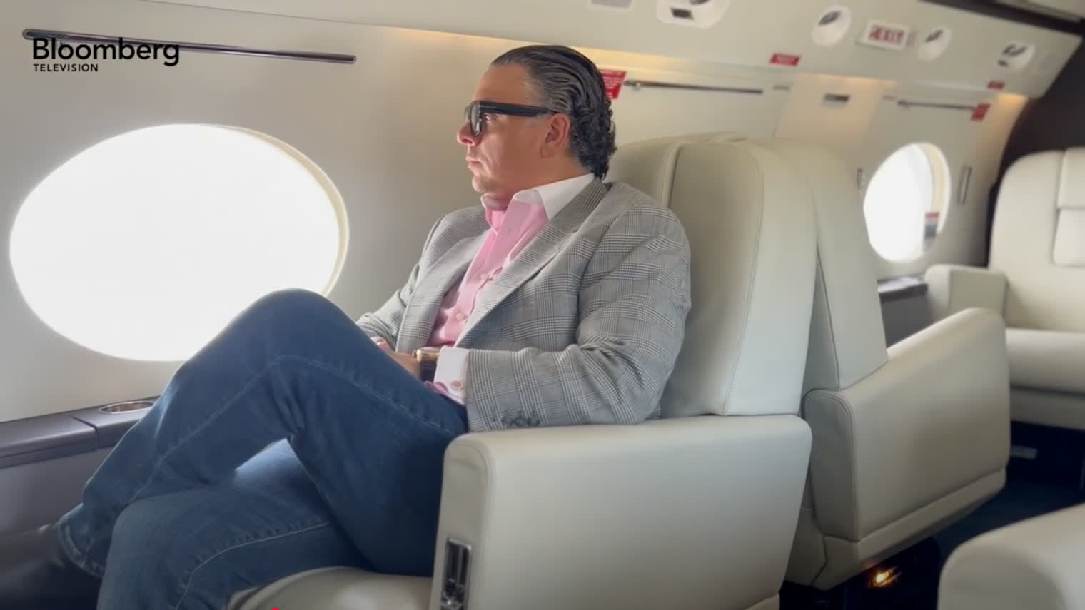 Dennis S. Amodio aboard a Legacy Aviation jet during his Bloomberg Television interview